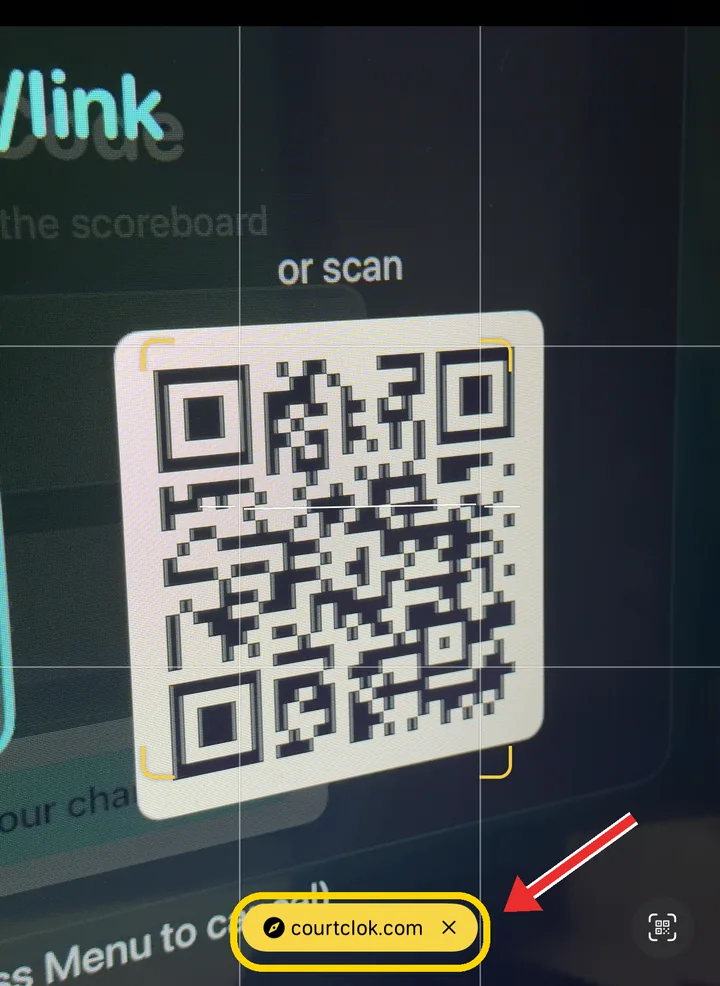 Phone camera scanning the Apple TV sign-in QR code with the courtclok.com link highlighted